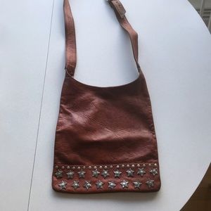 Shoulder bag, brown leather, silver metal stars.
